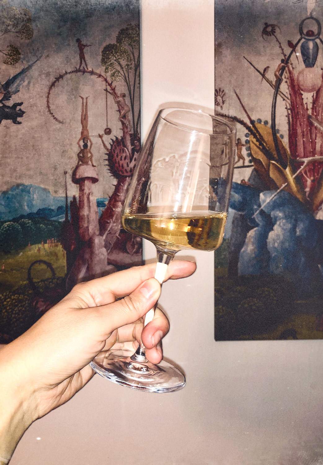 Hand-Holding-Glass-Of-White-Wine