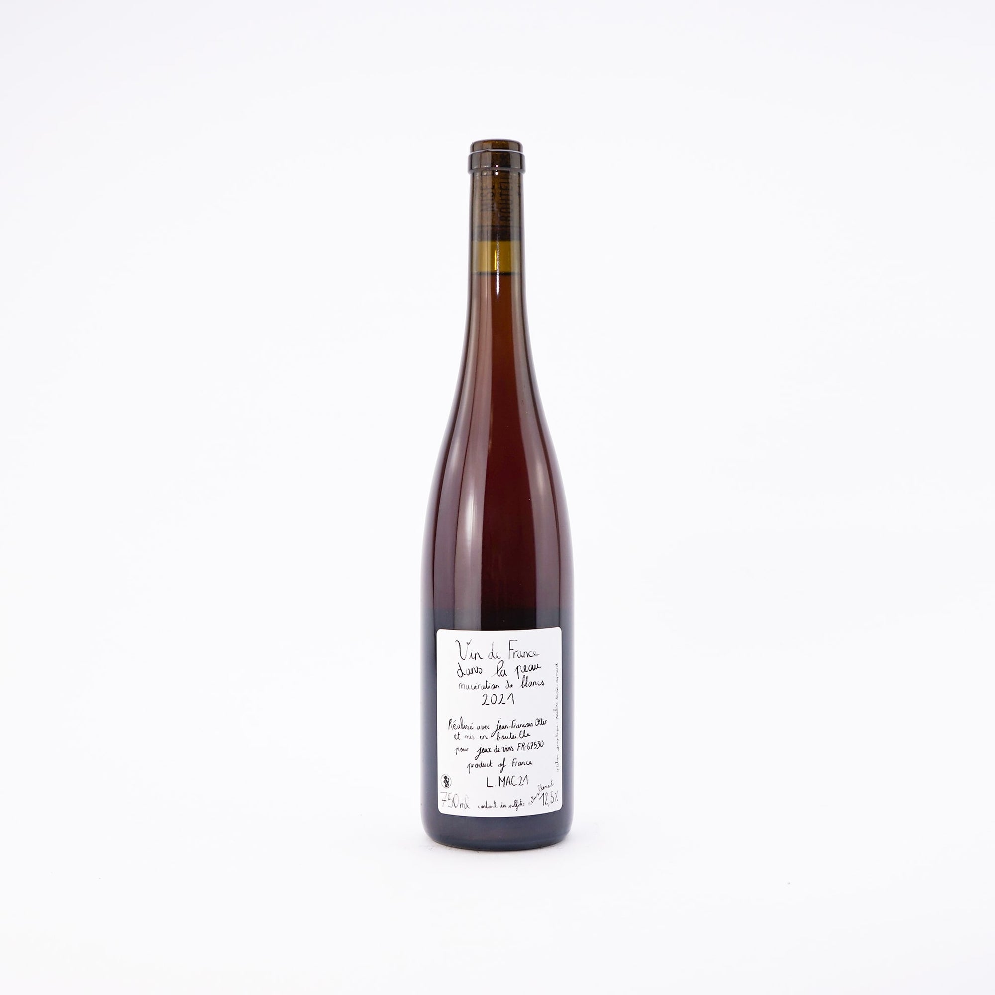 A bottle of orange natural wine cuvee Dans La Peau by Jeux De Vins Alsace France Back View