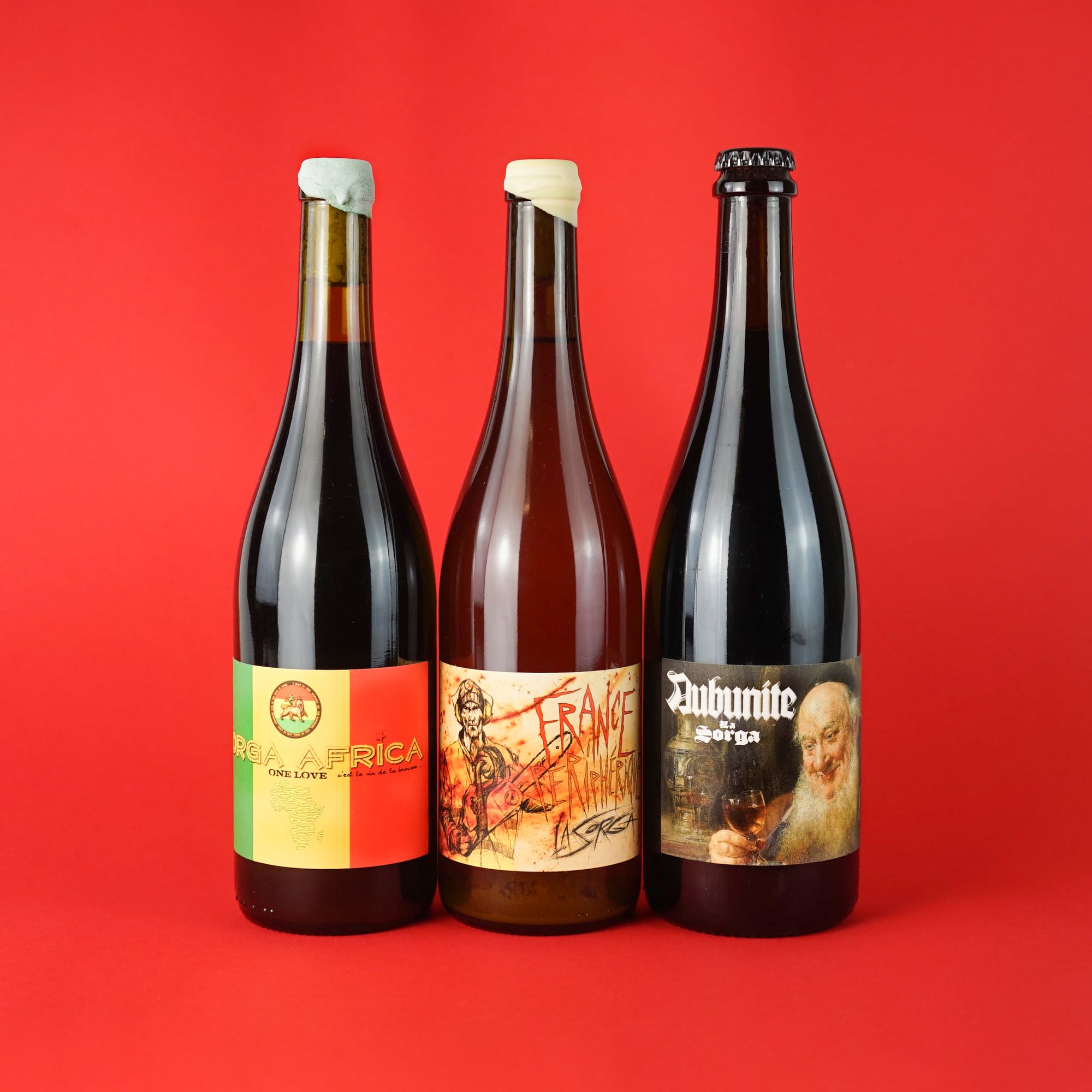 Three Bottles Of Natural Wine with funny labels on red background