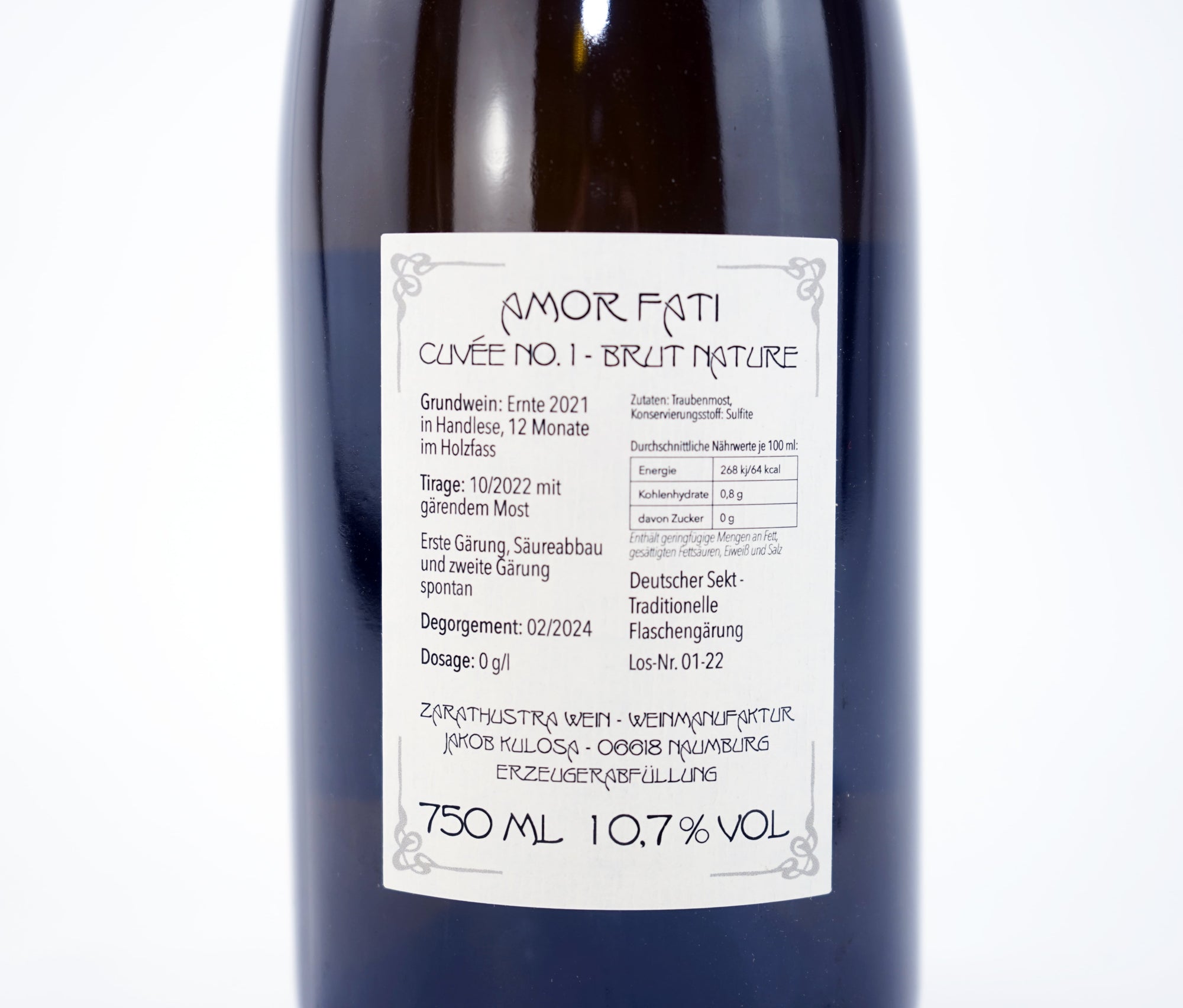 Wine bottle with a label on a white background close up